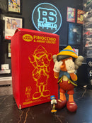 Boneco KAWS Pinocchio & Jiminy Cricket Vinyl Figure 25 CM - Pronta Entrega